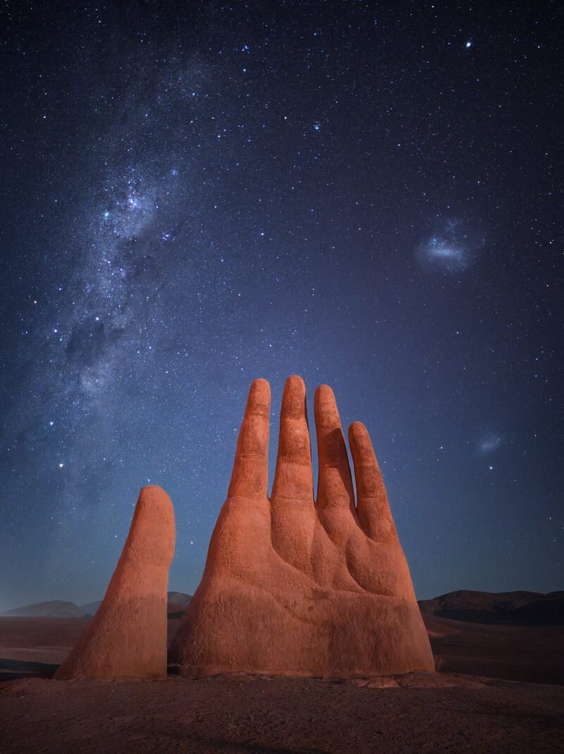 The Hand of God by Mihail Minkov - the Milky Way core rising over a landscape